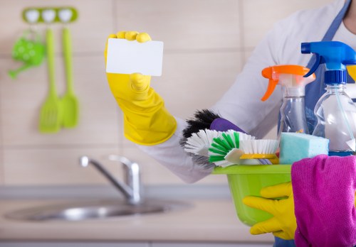 Office cleaner tidying a professional workspace in SE13